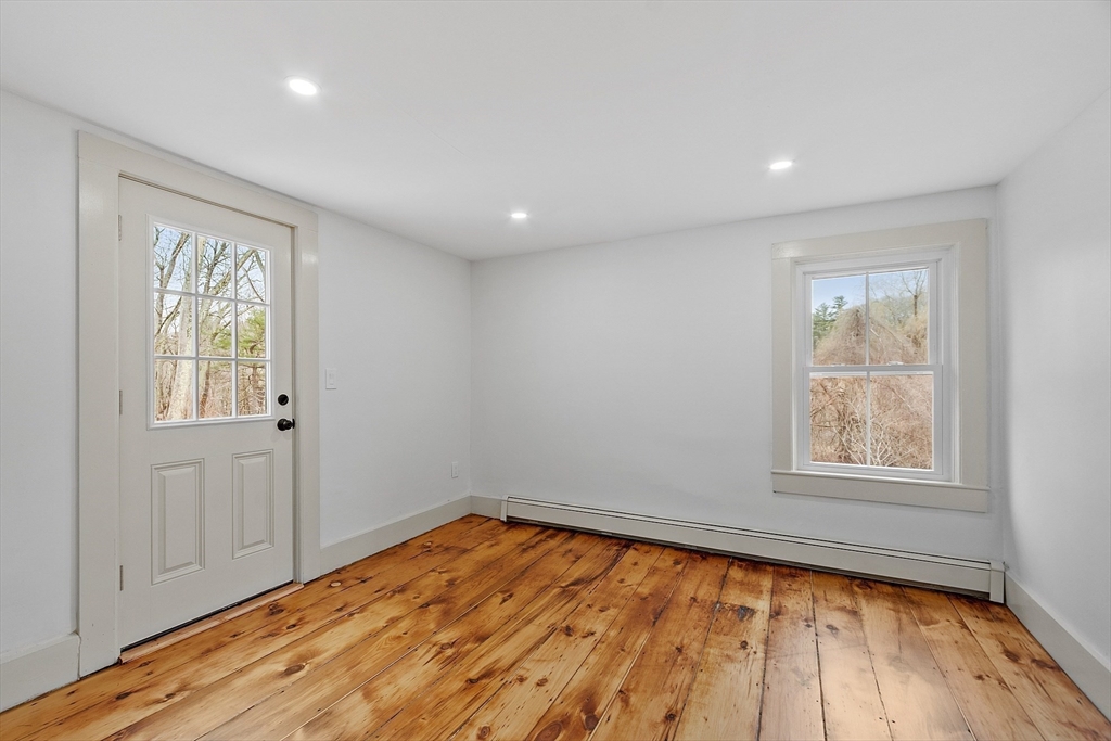 453 Main Street Northborough, MA 01532 - Photo 36 of 42 an empty room with wooden floor and windows
