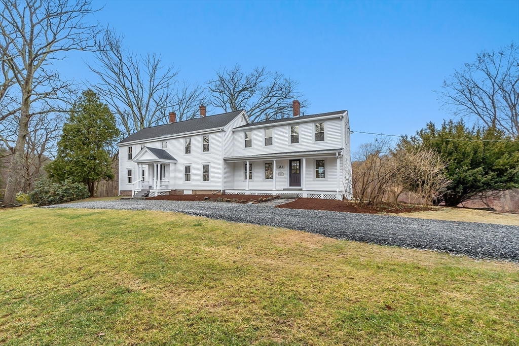453 Main Street Northborough, MA 01532 - Photo 4 of 42 a view of a white house with a large pool and large trees