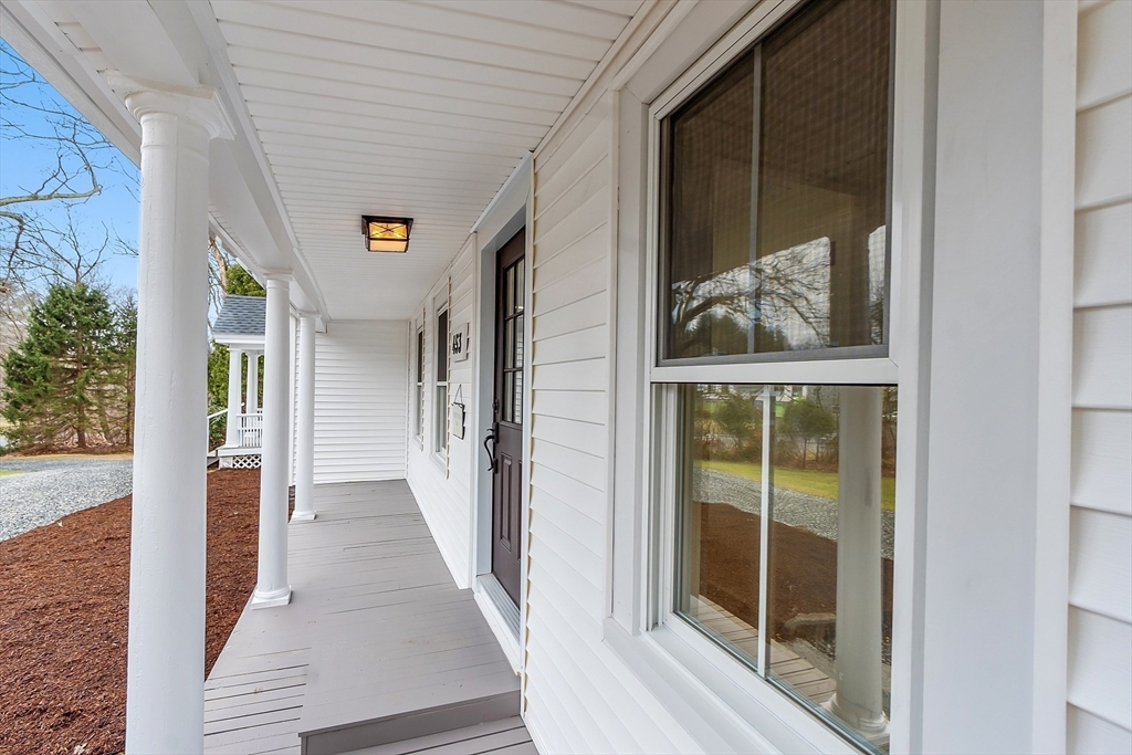 453 Main Street Northborough, MA 01532 - Photo 6 of 42 a view of a hallway with wooden floor and windows