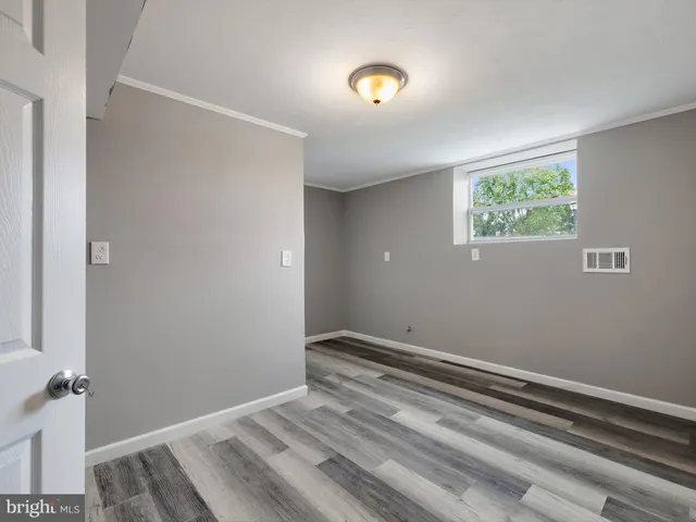 a view of room with window and ceiling fan