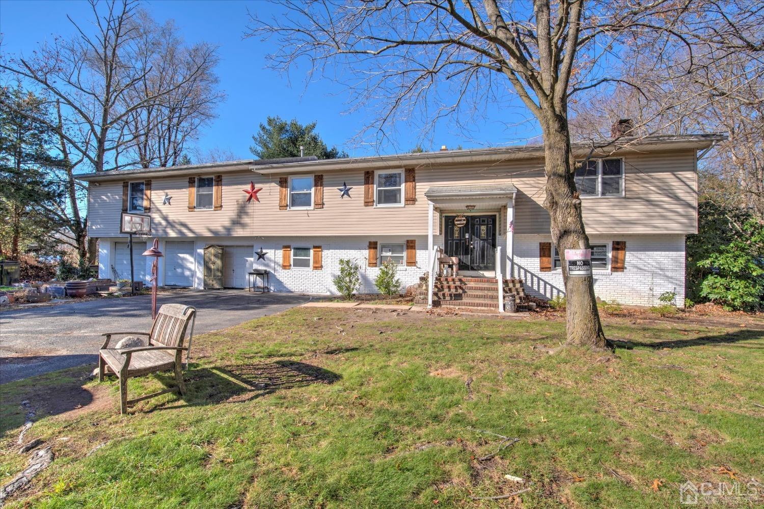 59 Sunnyside Road Howell, NJ 07731 - Photo 1 of 26 a view of a house with backyard and a tree