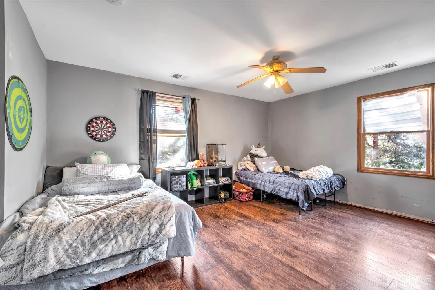 59 Sunnyside Road Howell, NJ 07731 - Photo 14 of 26 a bedroom with two beds and a window