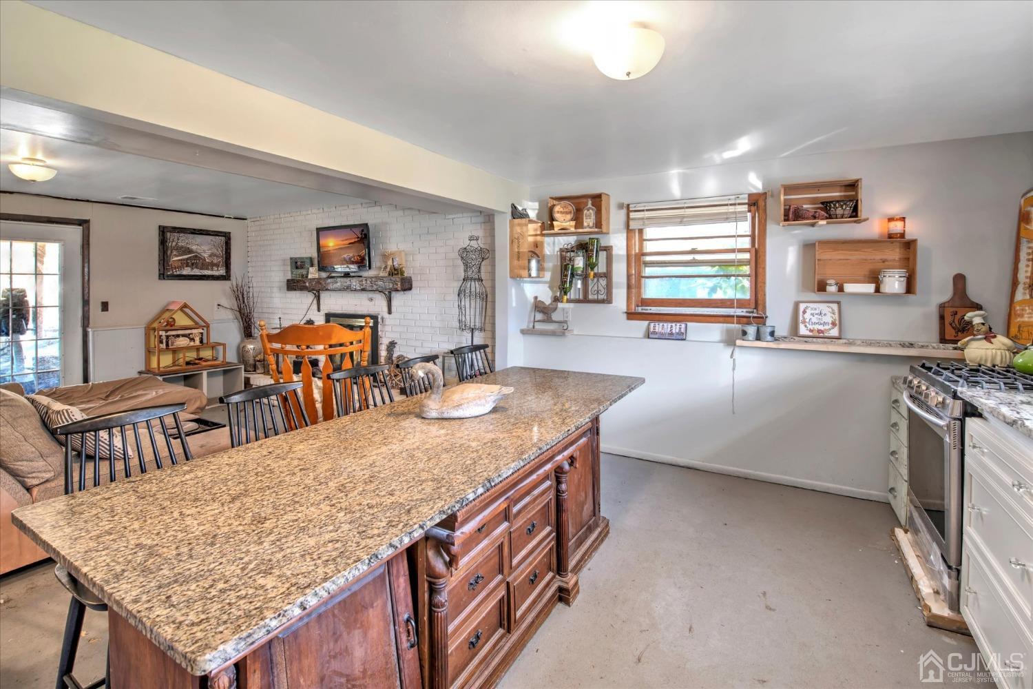 59 Sunnyside Road Howell, NJ 07731 - Photo 17 of 26 a living room with stainless steel appliances granite countertop furniture and a kitchen view