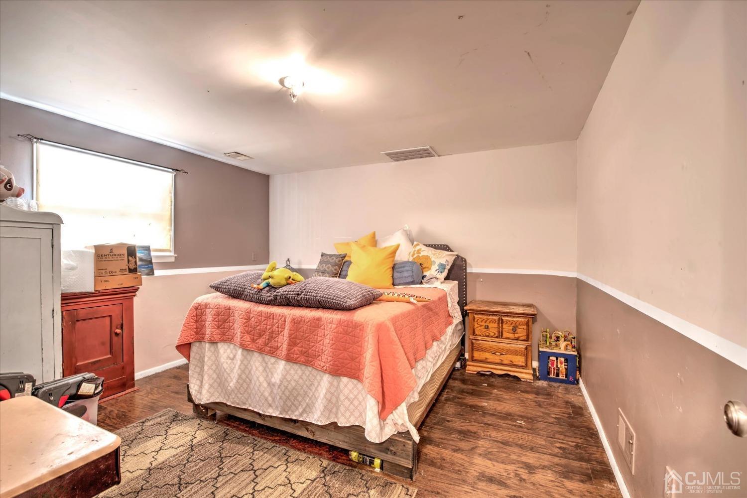59 Sunnyside Road Howell, NJ 07731 - Photo 20 of 26 a bed room with a bed and two night stand