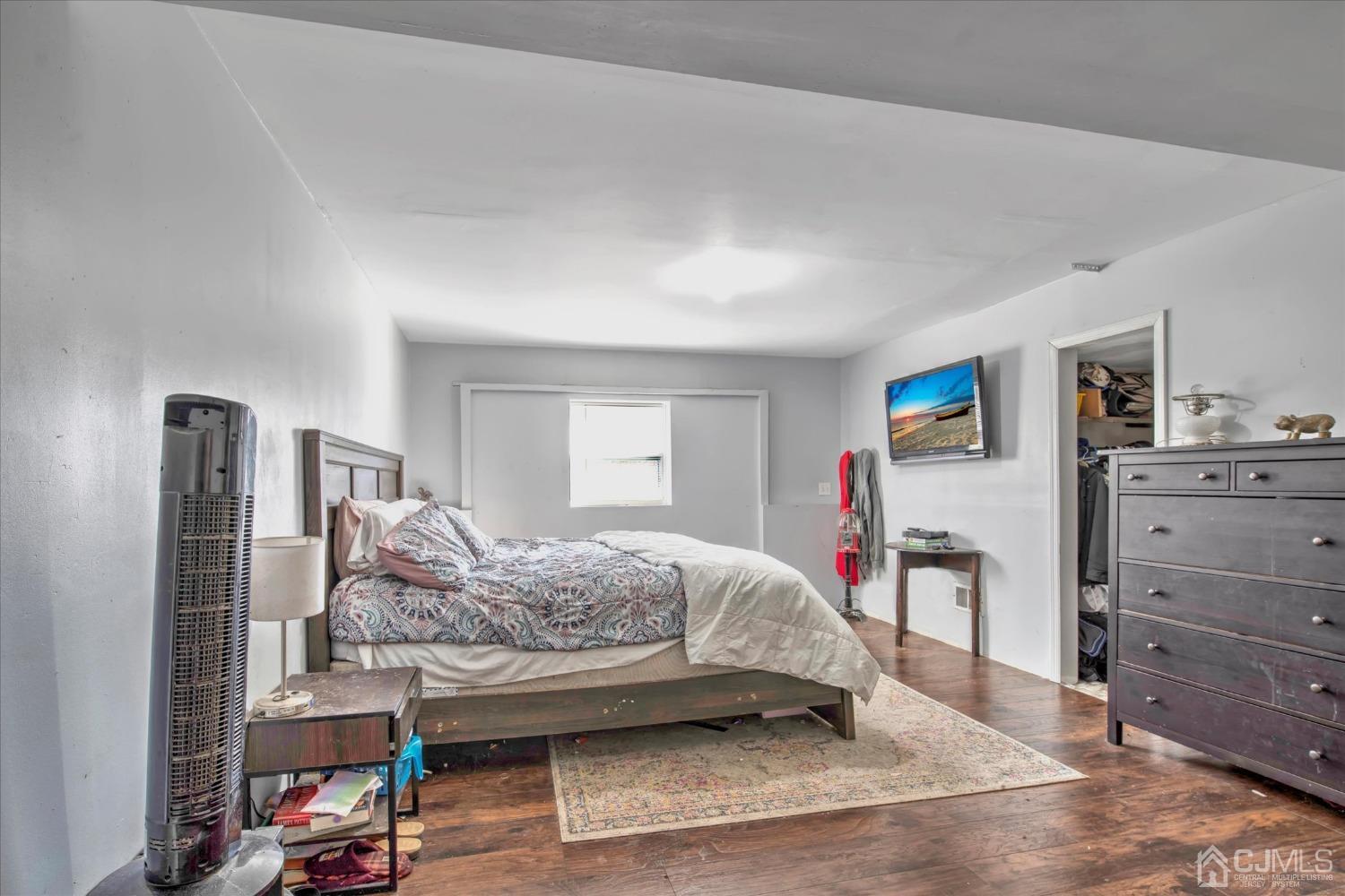 59 Sunnyside Road Howell, NJ 07731 - Photo 21 of 26 a bedroom with a bed and a dresser