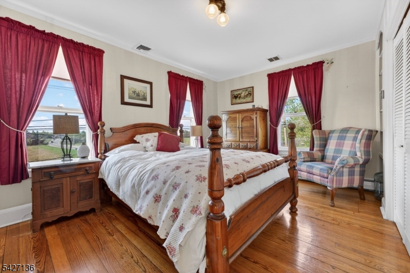 272 Skillman Road Skillman, NJ 08558 - Photo 17 of 49 a bedroom with a bed and wooden floor