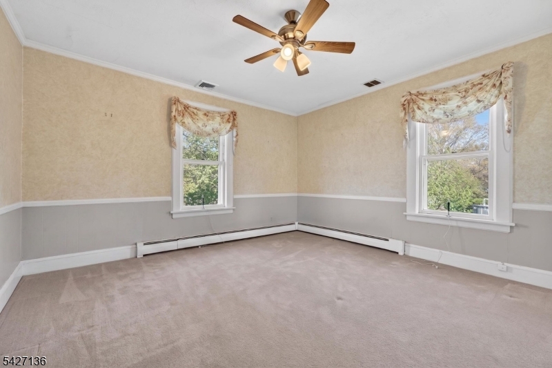 272 Skillman Road Skillman, NJ 08558 - Photo 18 of 49 an empty room with windows and fan