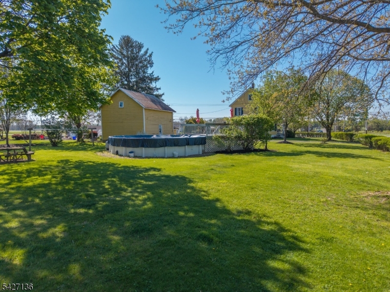 272 Skillman Road Skillman, NJ 08558 - Photo 39 of 49 a view of a house with a big yard and a large tree