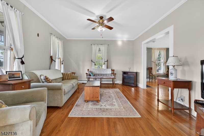 272 Skillman Road Skillman, NJ 08558 - Photo 8 of 49 a living room with furniture and a wooden floor