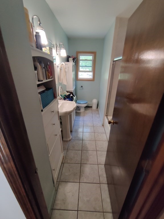 439 Massapoag Avenue Sharon, MA 02067 - Photo 14 of 22 a view of living room with furniture and a mirror