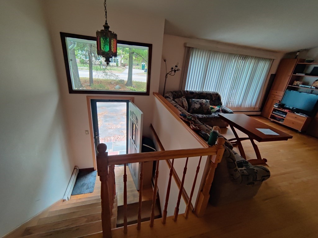 439 Massapoag Avenue Sharon, MA 02067 - Photo 2 of 22 a view of a balcony with furniture and window