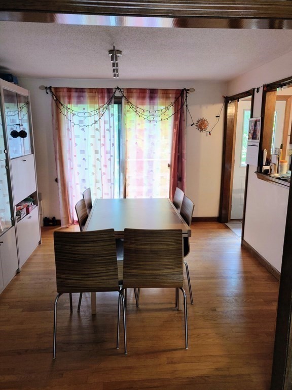 439 Massapoag Avenue Sharon, MA 02067 - Photo 5 of 22 a living room with furniture and a window