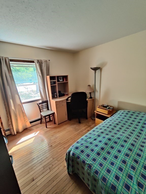 439 Massapoag Avenue Sharon, MA 02067 - Photo 8 of 22 a bedroom with furniture and a window