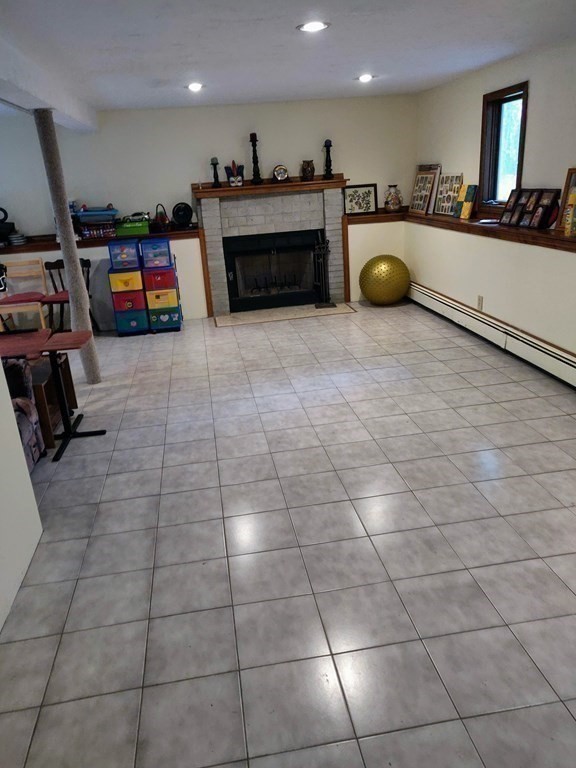439 Massapoag Avenue Sharon, MA 02067 - Photo 10 of 22 a kitchen with kitchen island a sink a counter and stainless steel appliances