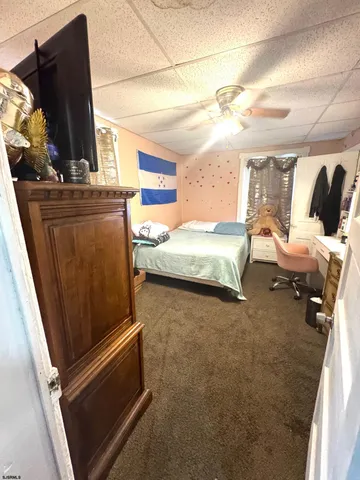 a bedroom with bed and window