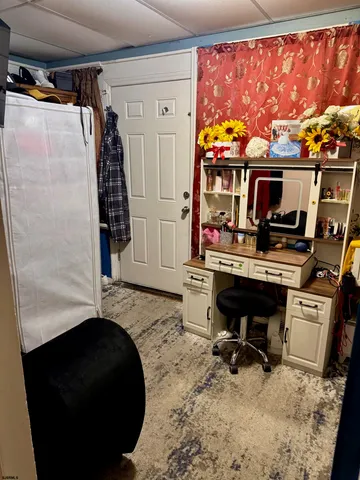 a living room with fish tank and a flat screen tv