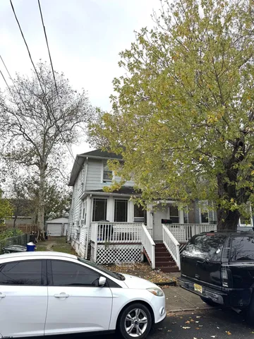 a front view of a house with parking space