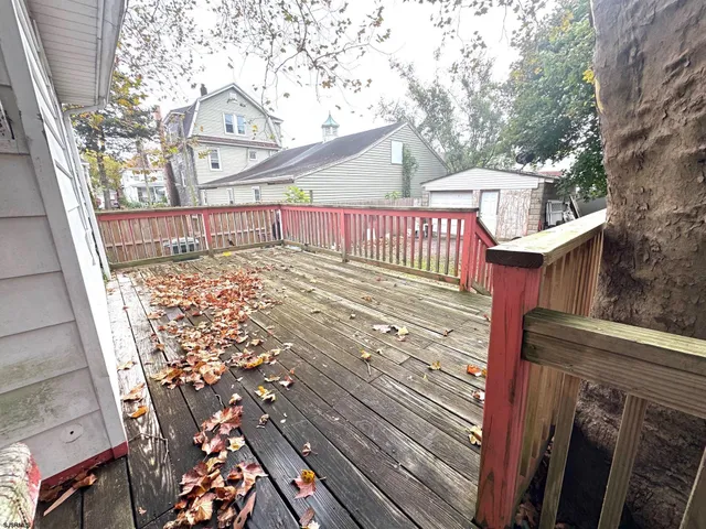 a view of a pathway with a wrought iron stairs
