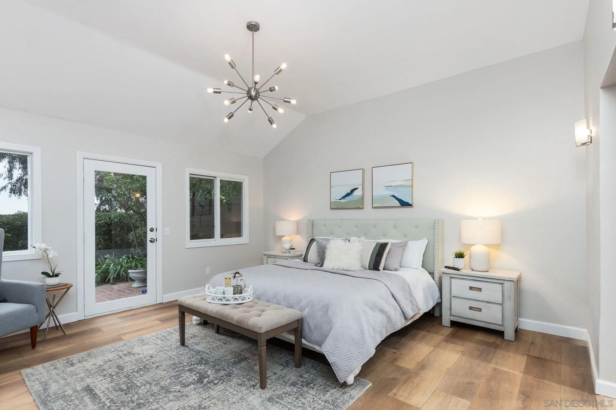 1863 Caminito Quintero La Jolla, CA 92037 - Photo 12 of 27 a bedroom with a bed and wooden floor