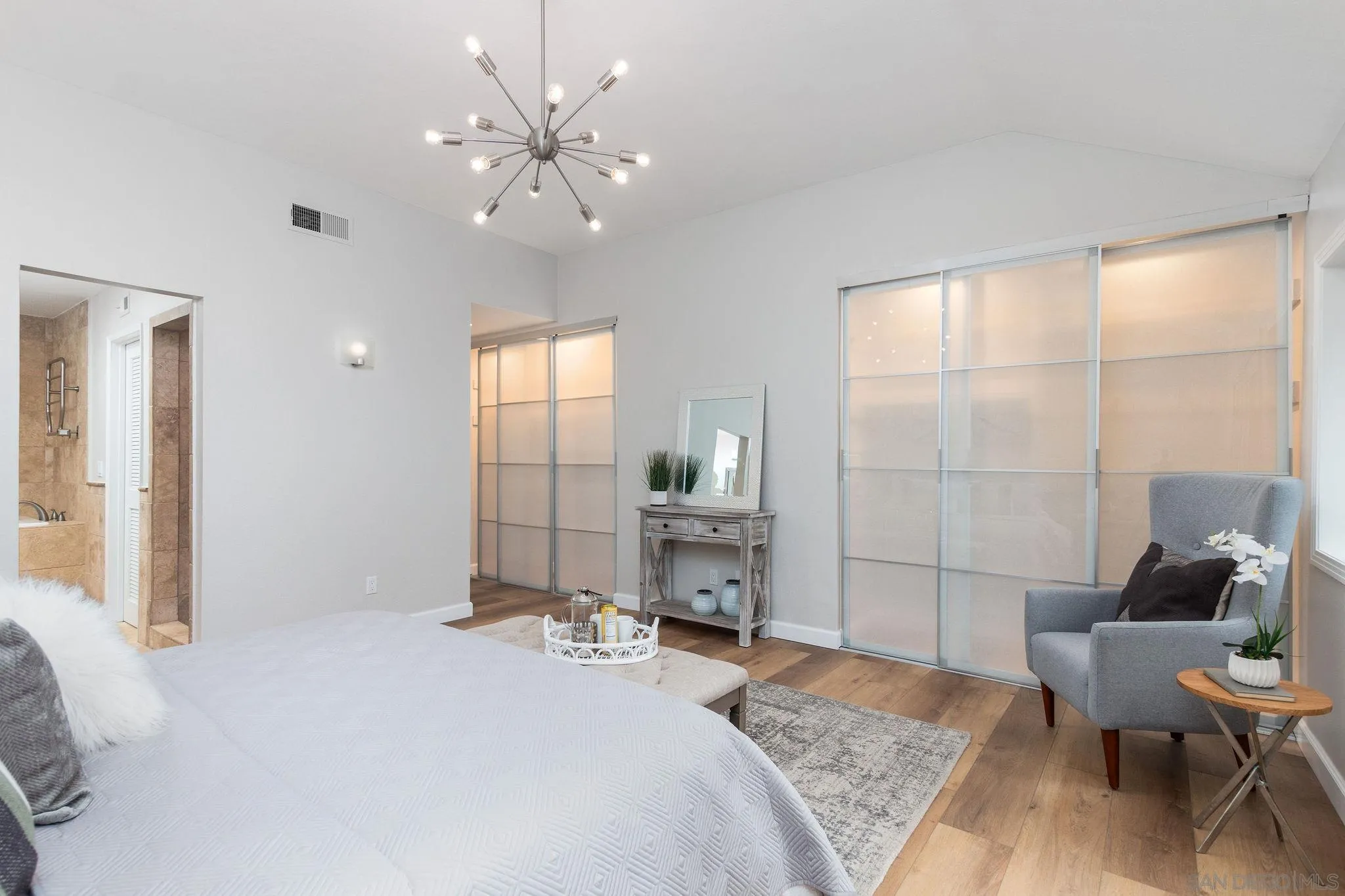 1863 Caminito Quintero La Jolla, CA 92037 - Photo 13 of 27 a bedroom with a bed and a large window