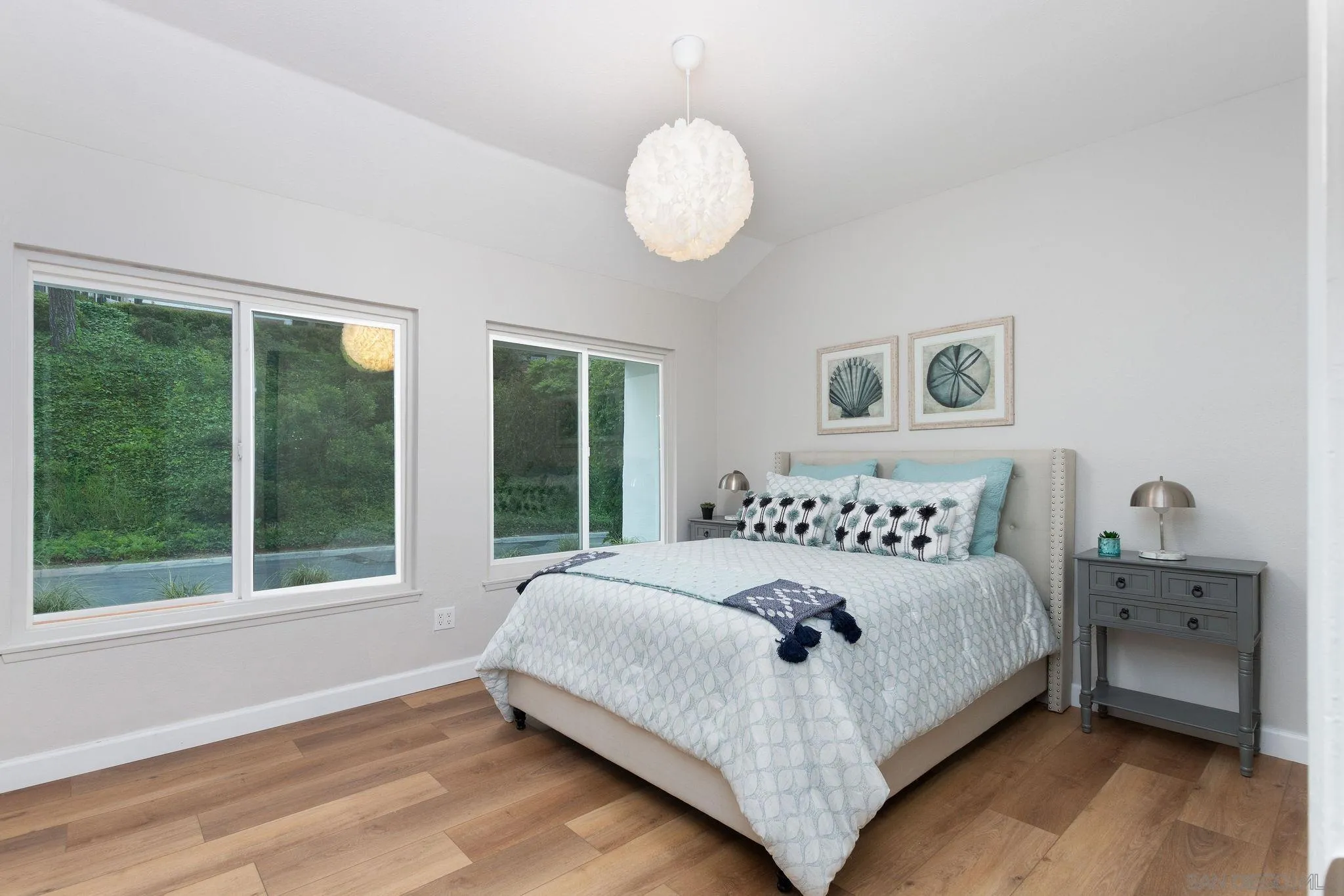 1863 Caminito Quintero La Jolla, CA 92037 - Photo 15 of 27 a bedroom with a bed and window