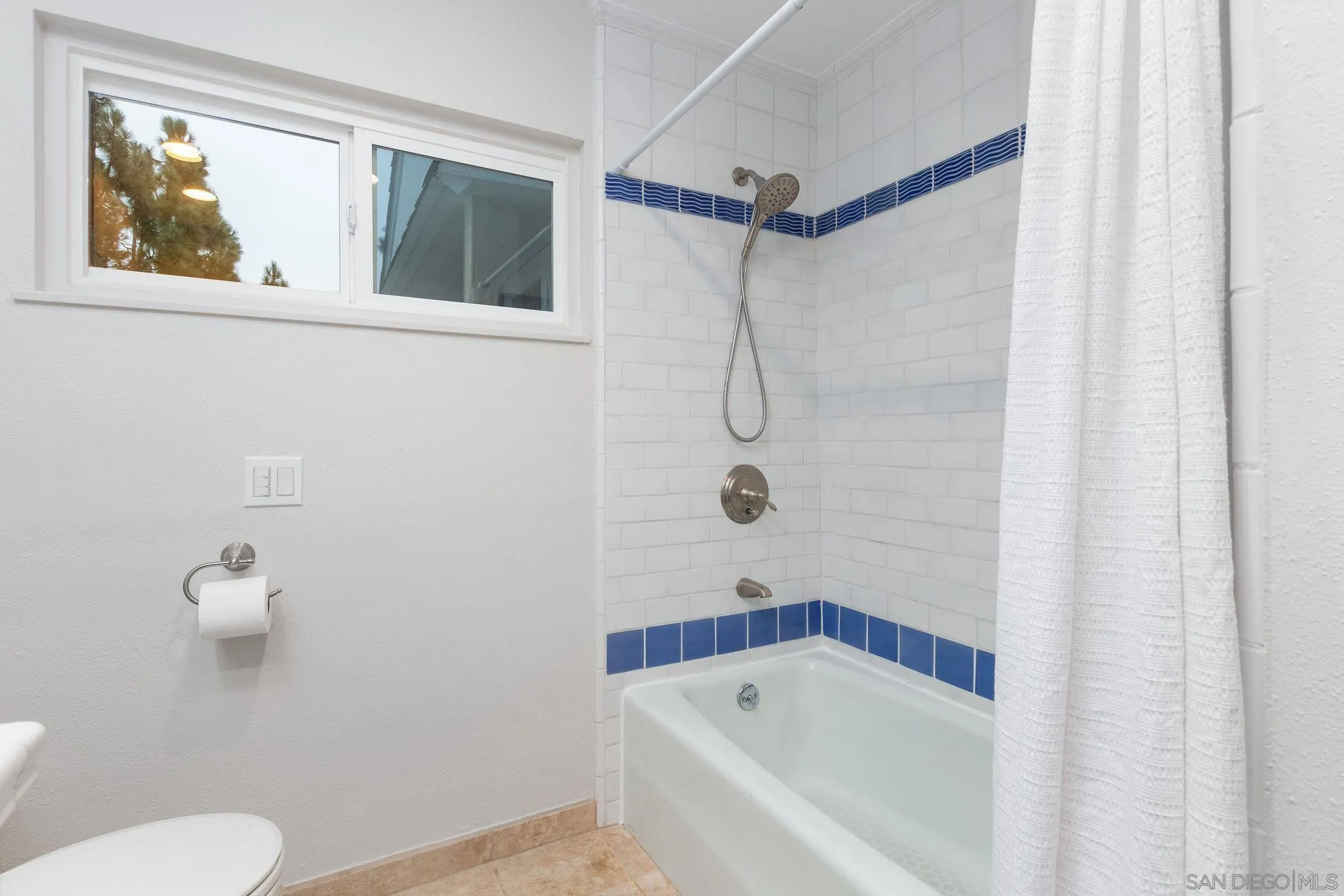 1863 Caminito Quintero La Jolla, CA 92037 - Photo 18 of 27 a bathroom with a bath tub and a shower