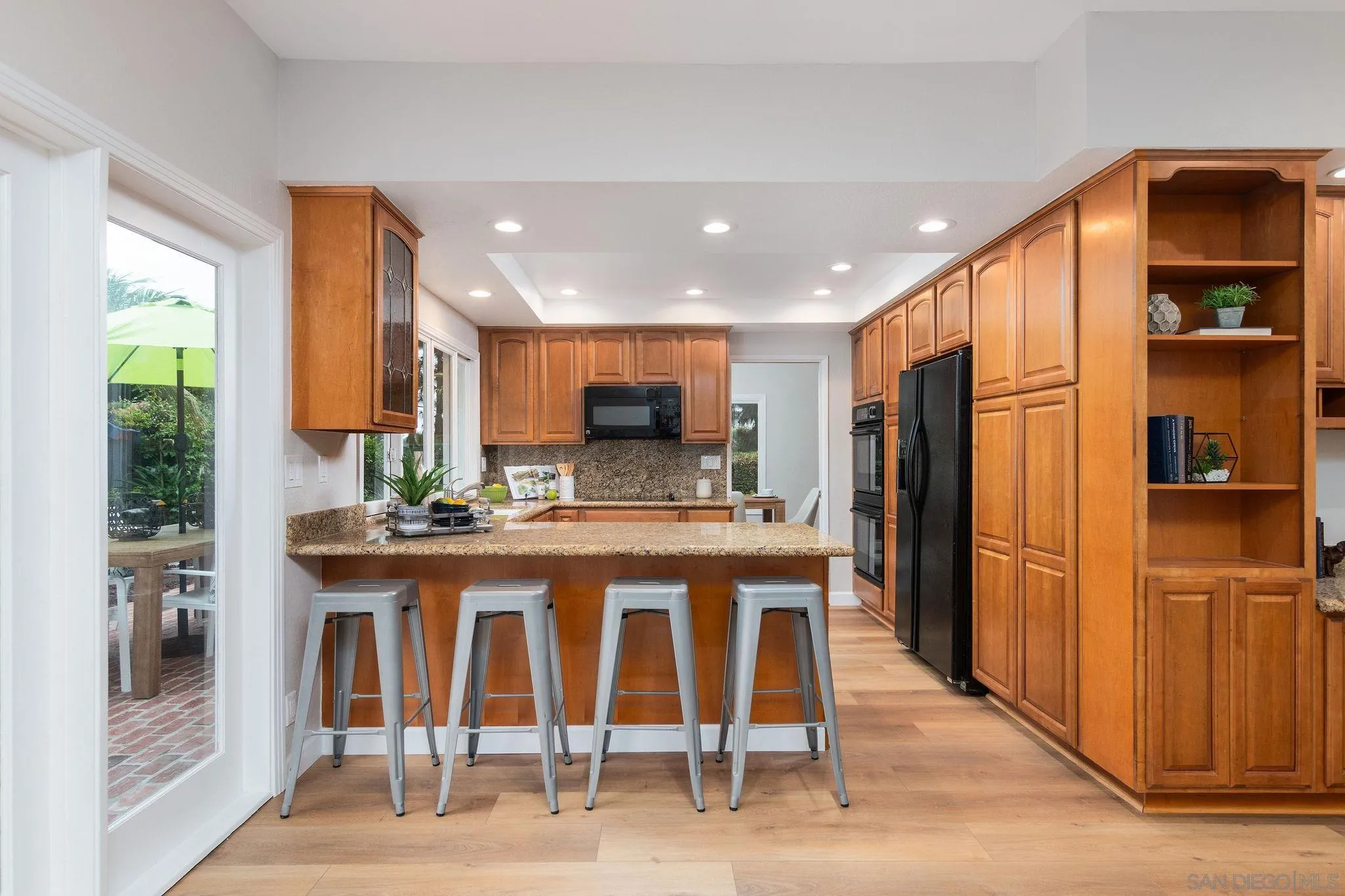 1863 Caminito Quintero La Jolla, CA 92037 - Photo 8 of 27 a kitchen with stainless steel appliances granite countertop a refrigerator and a sink