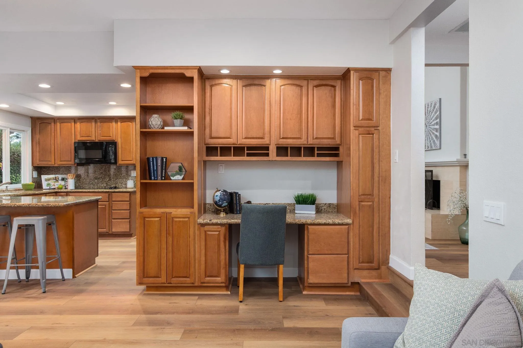 1863 Caminito Quintero La Jolla, CA 92037 - Photo 9 of 27 a kitchen with stainless steel appliances granite countertop a refrigerator a stove top oven and a sink