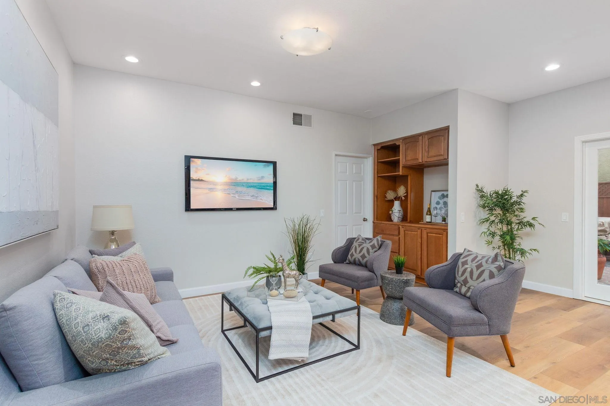 1863 Caminito Quintero La Jolla, CA 92037 - Photo 10 of 27 a living room with furniture and a potted plant