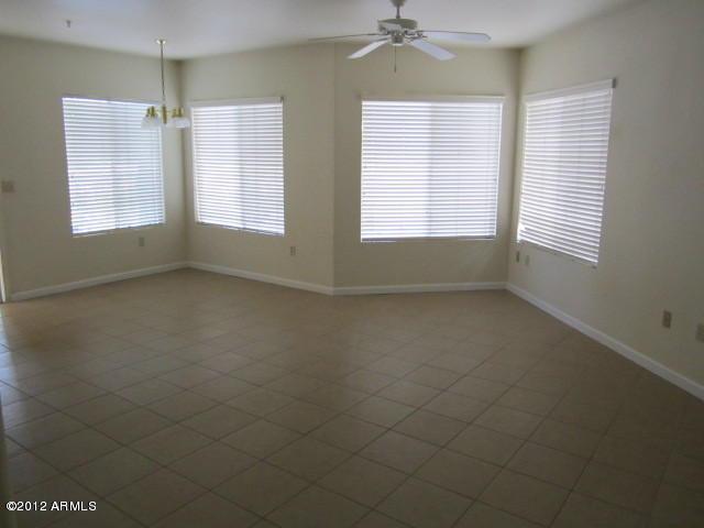 1825 West Ray Road, Unit 1110 Chandler, AZ 85224 - Photo 3 of 9 a view of an empty room with a window