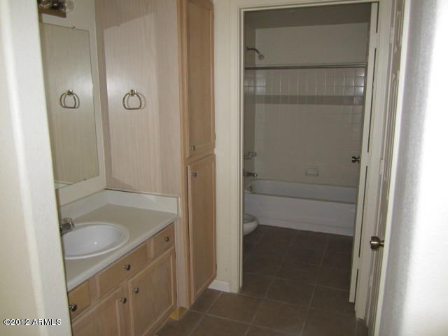 1825 West Ray Road, Unit 1110 Chandler, AZ 85224 - Photo 5 of 9 a bathroom with a sink and shower