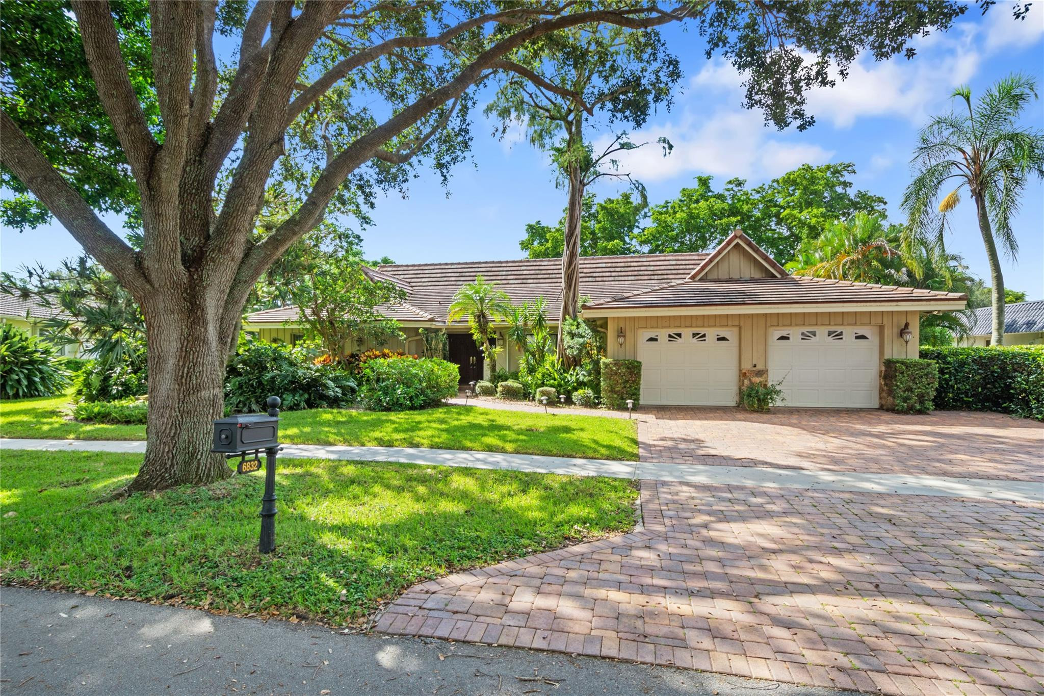 6832 Viento Way Boca Raton, FL 33433 - Photo 1 of 31 a front view of a house with a yard and a garage
