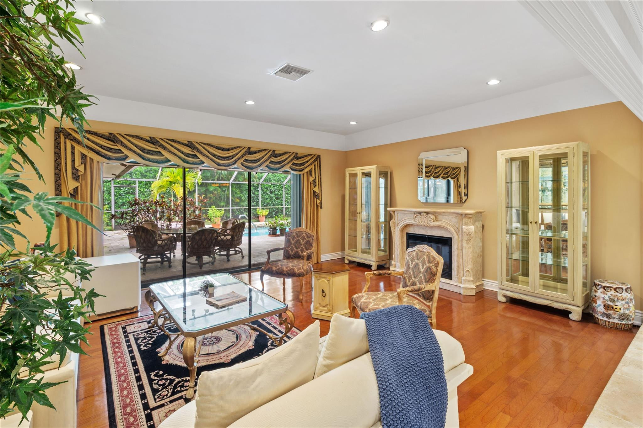 6832 Viento Way Boca Raton, FL 33433 - Photo 12 of 31 a living room with fireplace furniture and a large window