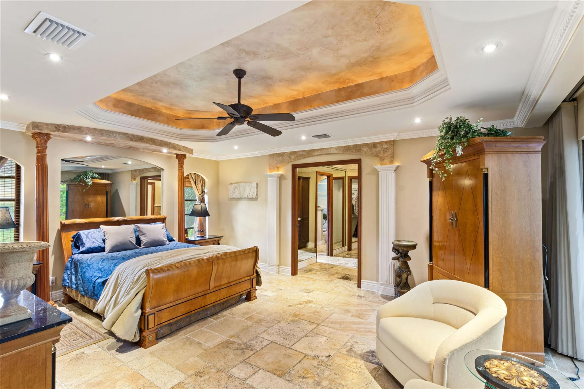 6832 Viento Way Boca Raton, FL 33433 - Photo 19 of 31 a bedroom with a large bed and a couch