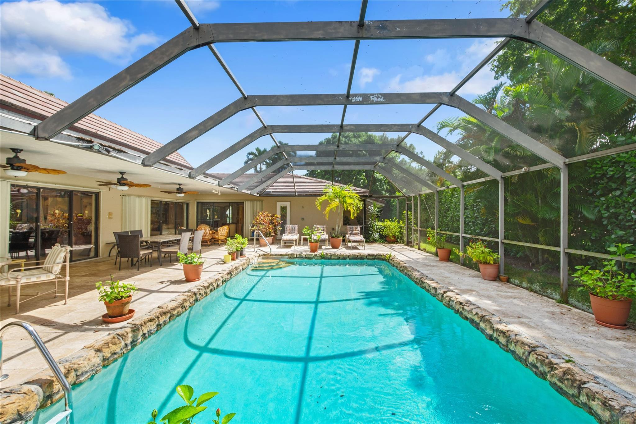 6832 Viento Way Boca Raton, FL 33433 - Photo 2 of 31 a view of a backyard with swimming pool