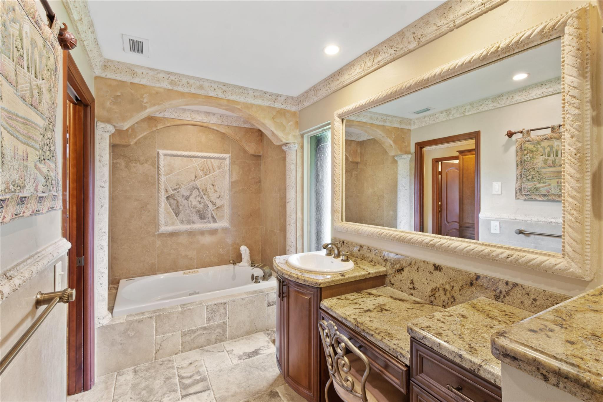 6832 Viento Way Boca Raton, FL 33433 - Photo 22 of 31 a bathroom with a granite countertop sink a mirror and a bathtub