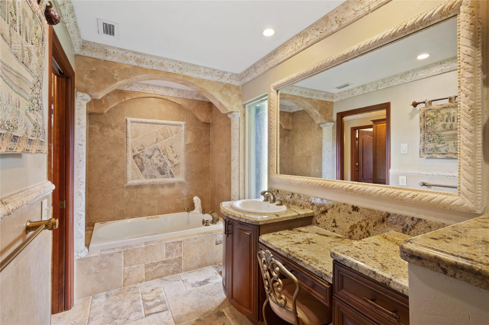 6832 Viento Way Boca Raton, FL 33433 - Photo 23 of 31 a bathroom with a granite countertop sink a mirror and a bathtub