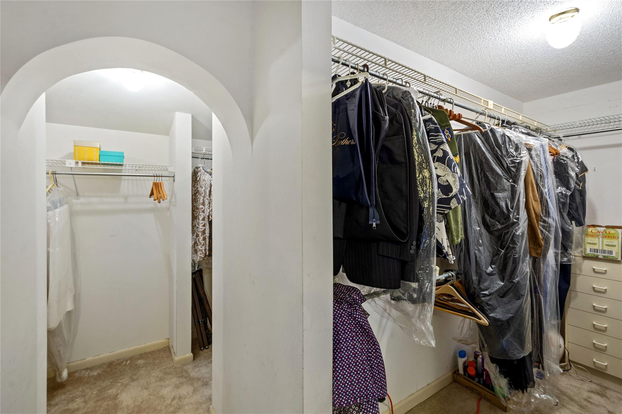 6832 Viento Way Boca Raton, FL 33433 - Photo 25 of 31 a view of walk in closet with clothes and shoes