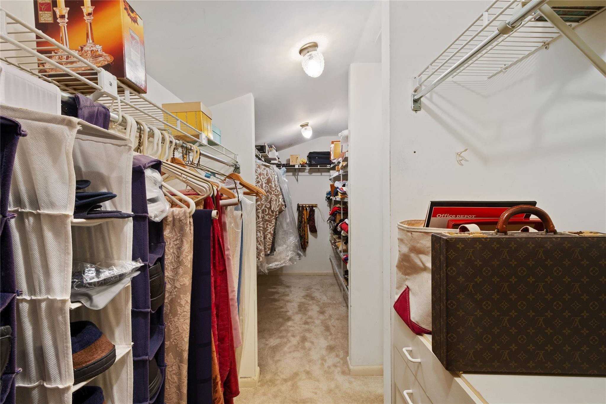 6832 Viento Way Boca Raton, FL 33433 - Photo 26 of 31 a view of walk in closet with clothes and shoes