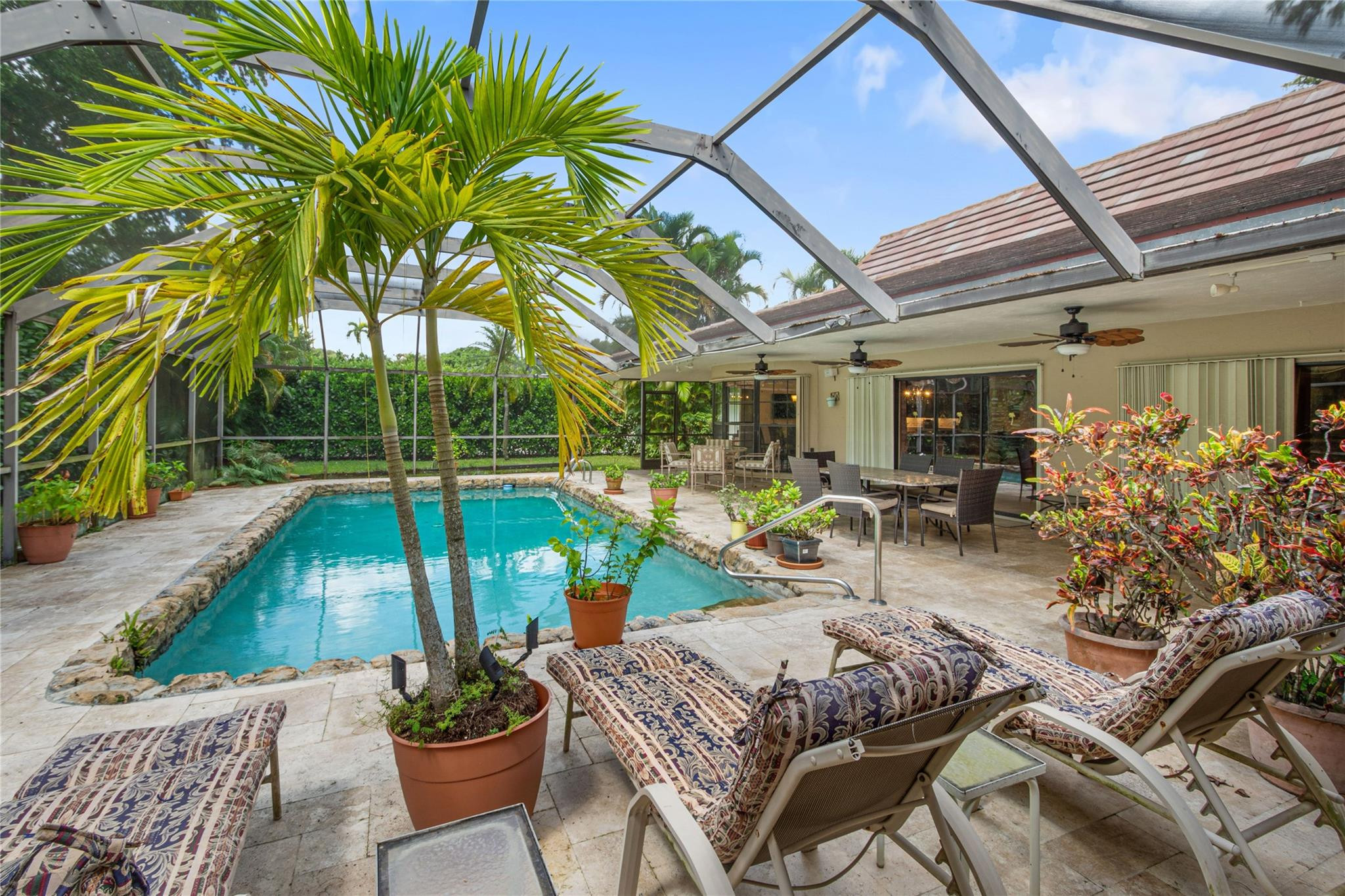 6832 Viento Way Boca Raton, FL 33433 - Photo 28 of 31 a view of swimming pool with outdoor seating and plants