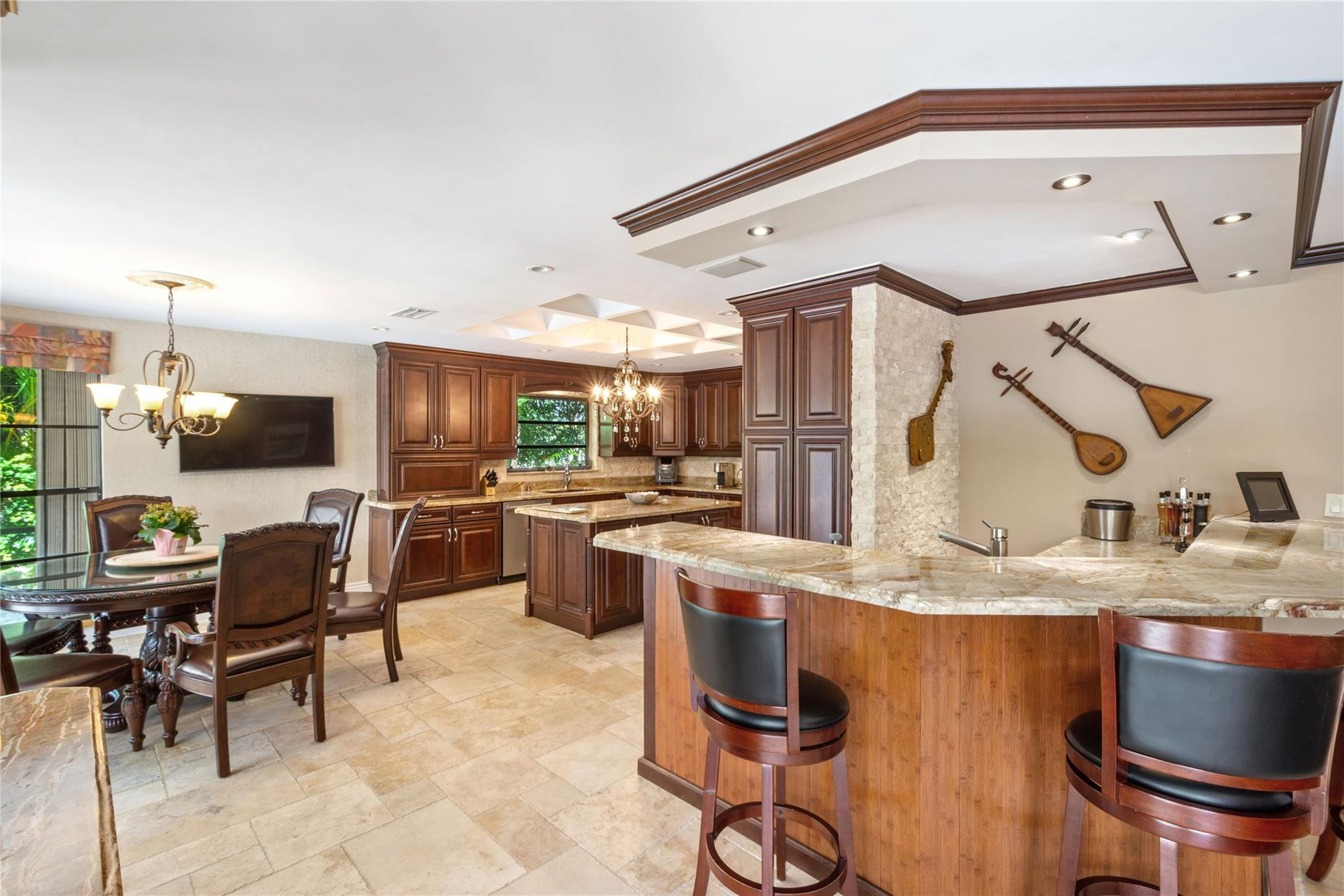 6832 Viento Way Boca Raton, FL 33433 - Photo 5 of 31 a kitchen with stainless steel appliances kitchen island granite countertop a sink and cabinets