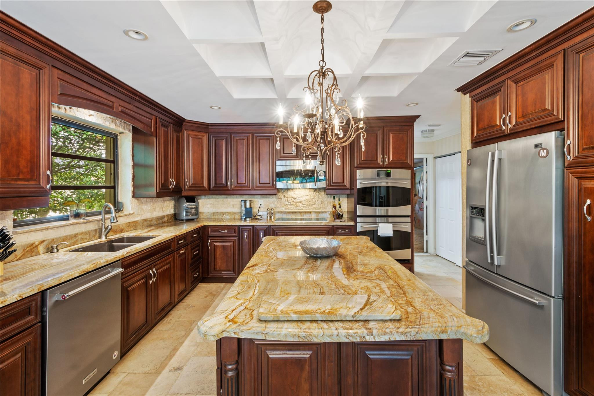 6832 Viento Way Boca Raton, FL 33433 - Photo 6 of 31 a kitchen with stainless steel appliances granite countertop a stove refrigerator and cabinets