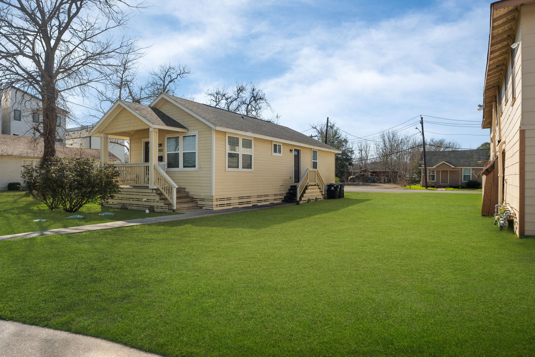 3422 Columbia Street Houston, TX 77018 - Photo 7 of 7 a view of a white house with a big yard and large trees