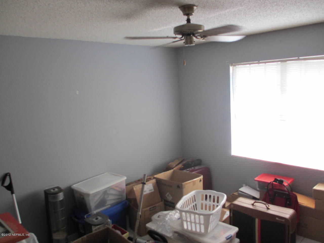 1303 Kettering Way Orange Park, FL 32073 - Photo 19 of 24 a room with furniture and a window
