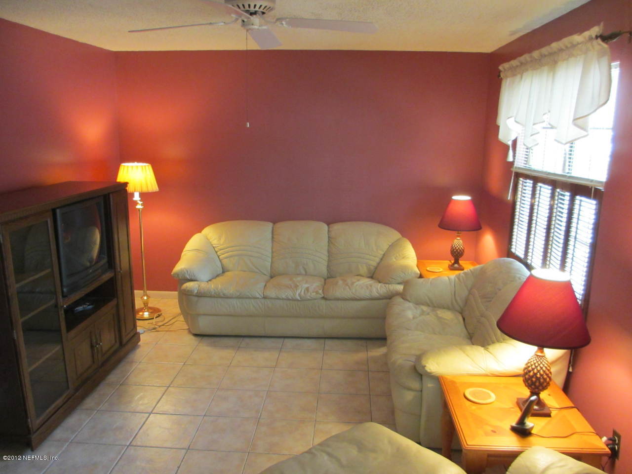 1303 Kettering Way Orange Park, FL 32073 - Photo 2 of 24 a living room with furniture and a fireplace