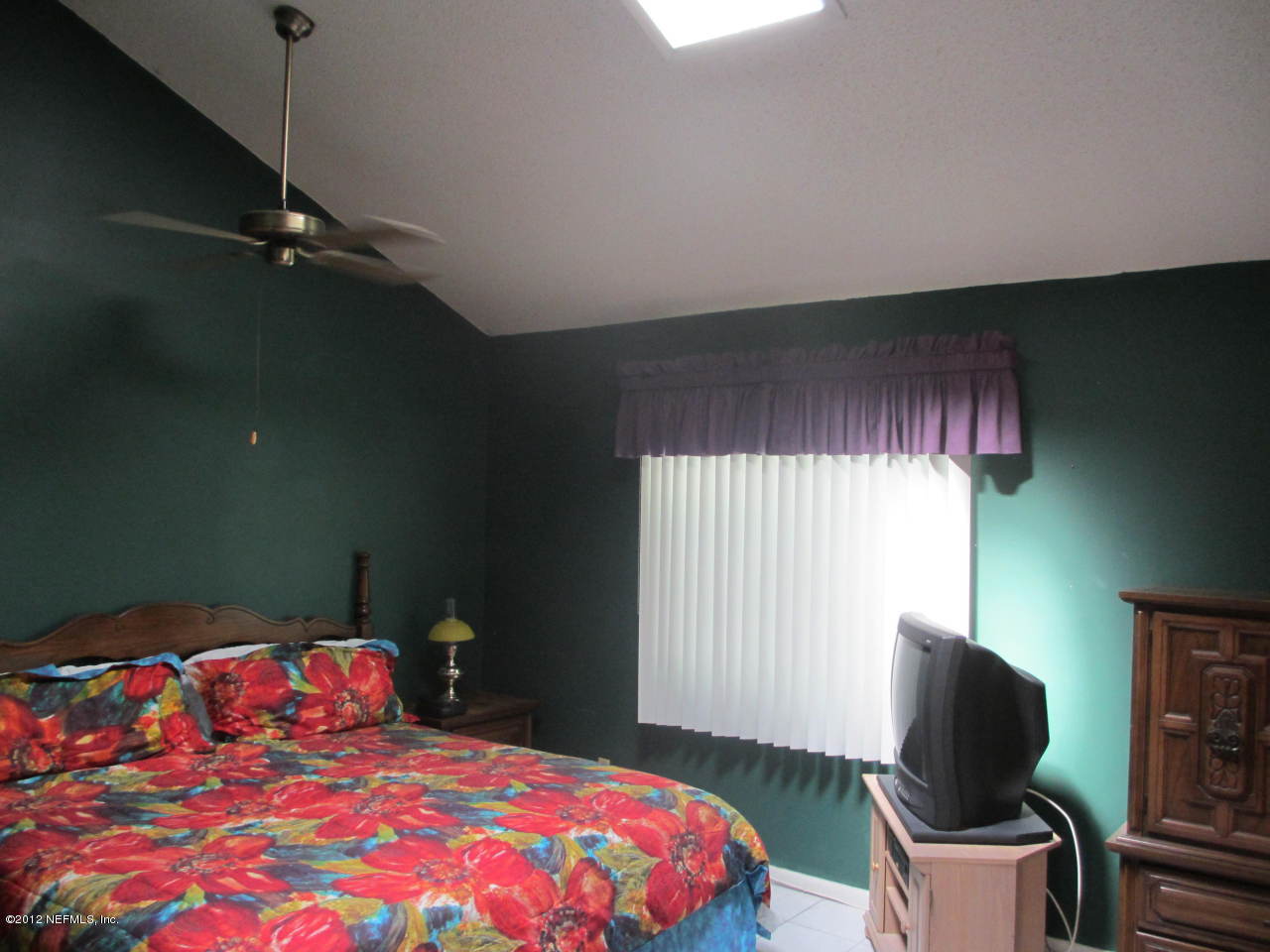 1303 Kettering Way Orange Park, FL 32073 - Photo 22 of 24 a bedroom with a bed and a window