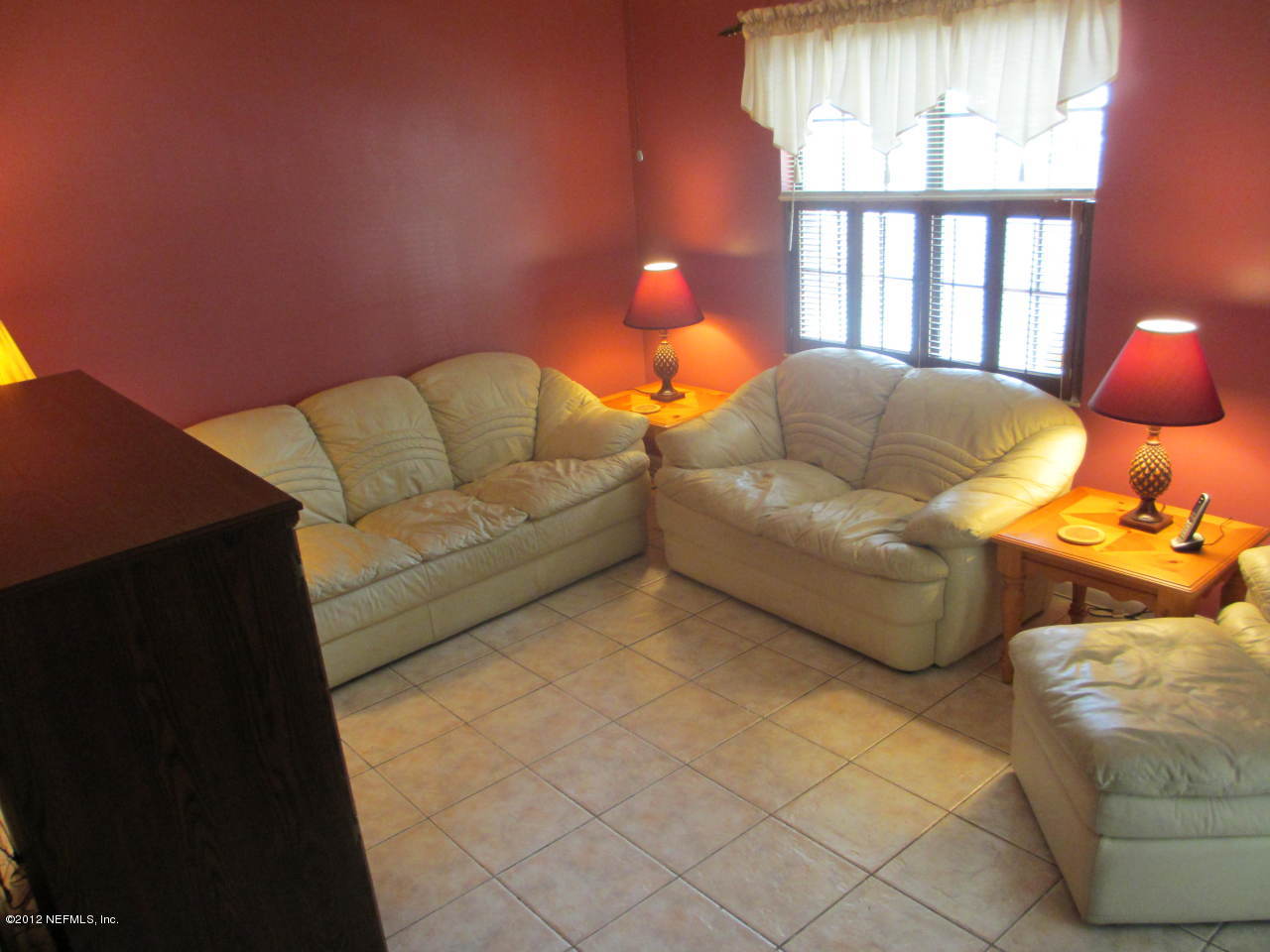 1303 Kettering Way Orange Park, FL 32073 - Photo 3 of 24 a bedroom with furniture and a large window