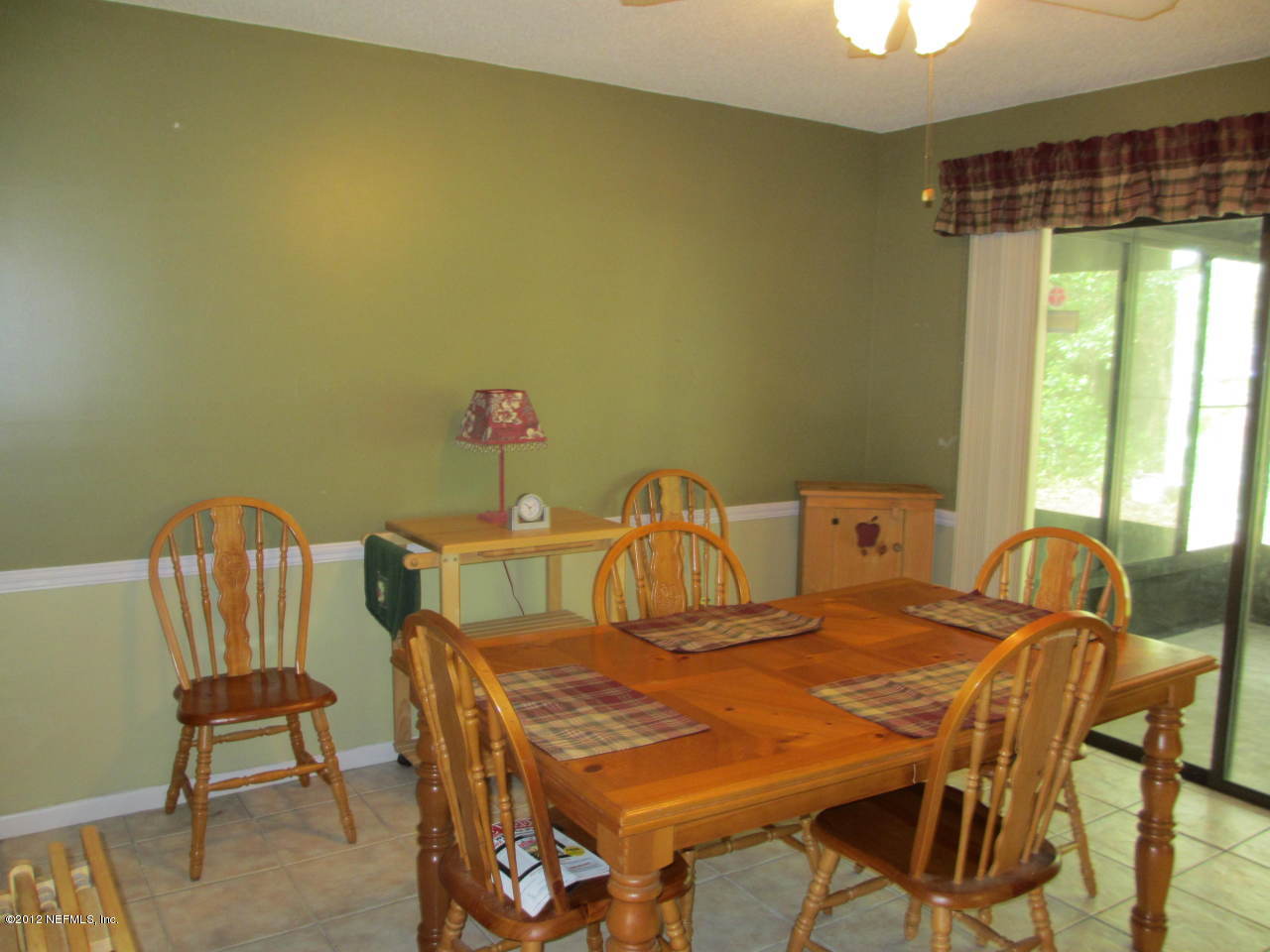 1303 Kettering Way Orange Park, FL 32073 - Photo 7 of 24 a dining room with a table and chairs