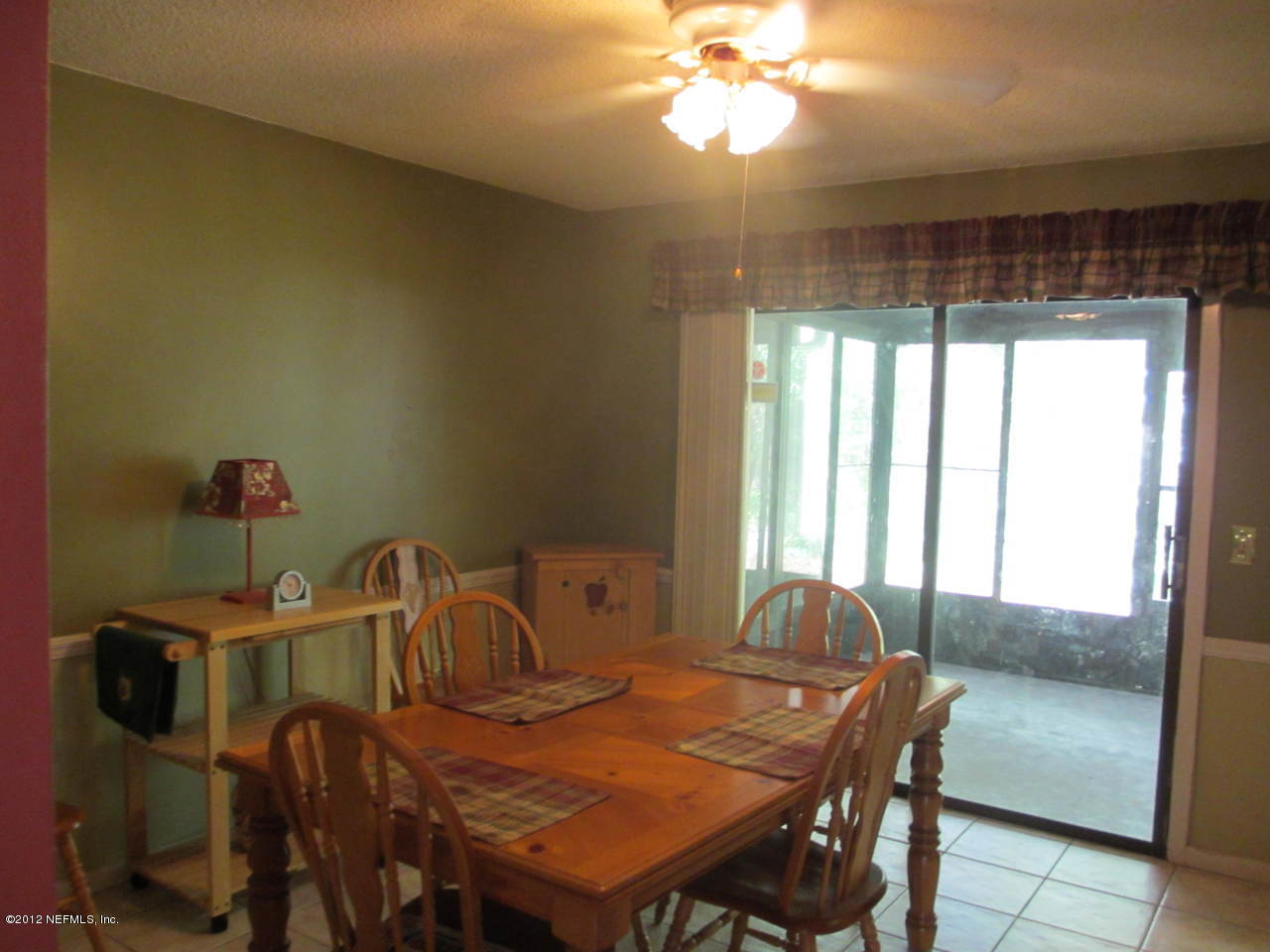 1303 Kettering Way Orange Park, FL 32073 - Photo 8 of 24 a view of a dining room with furniture window and outside view