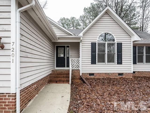 7201 Cedric Drive Raleigh, NC 27603 - Photo 2 of 25 a view of a house with a yard